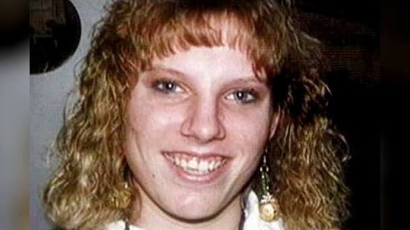 Portrait photograph of Colleen Slemmer, a young woman with curly blonde hair.